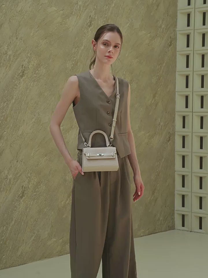 Stylish Kelly Bag With Top Handles And Shoulder Strap